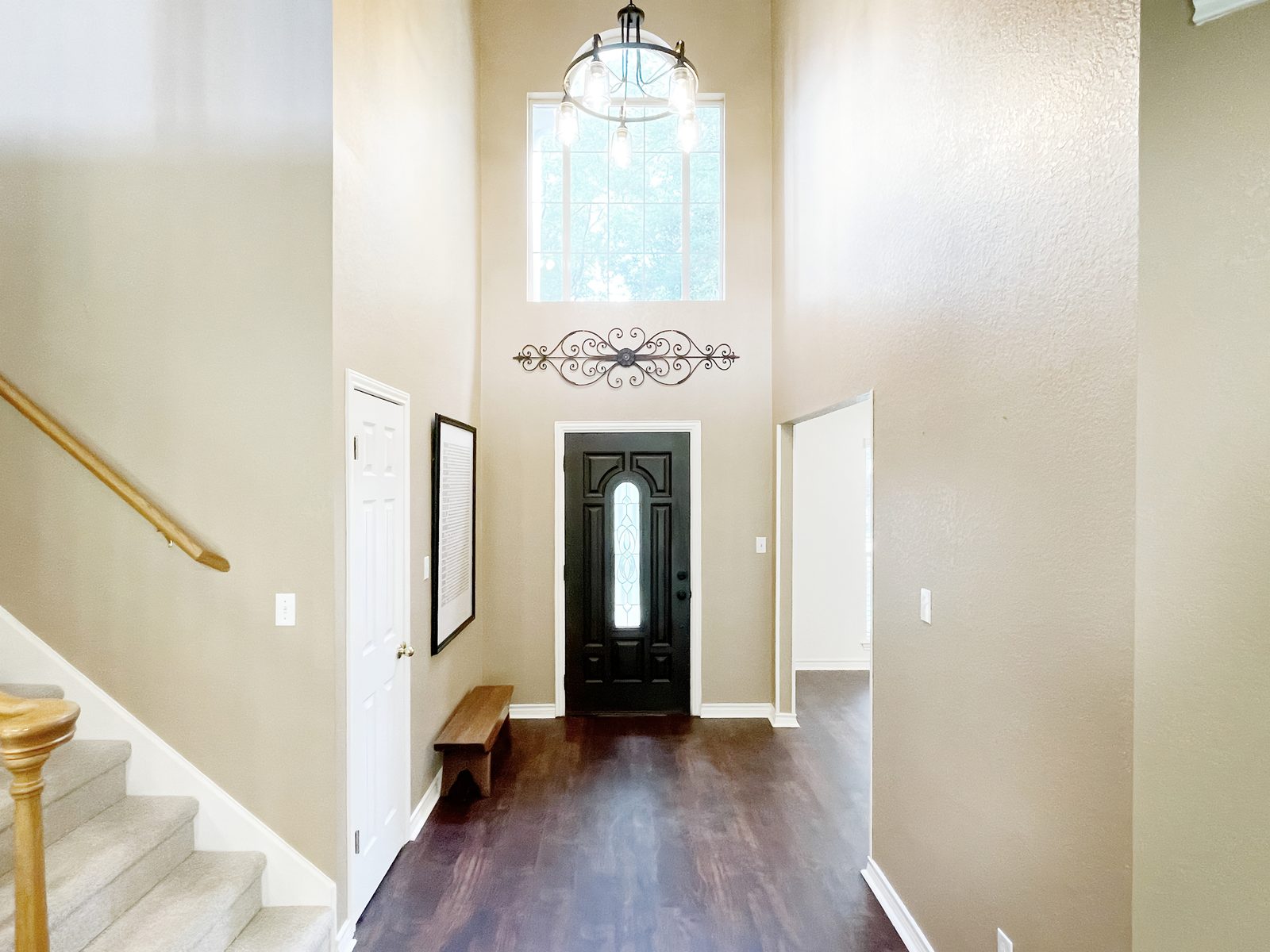 Two-story entry with dark front door