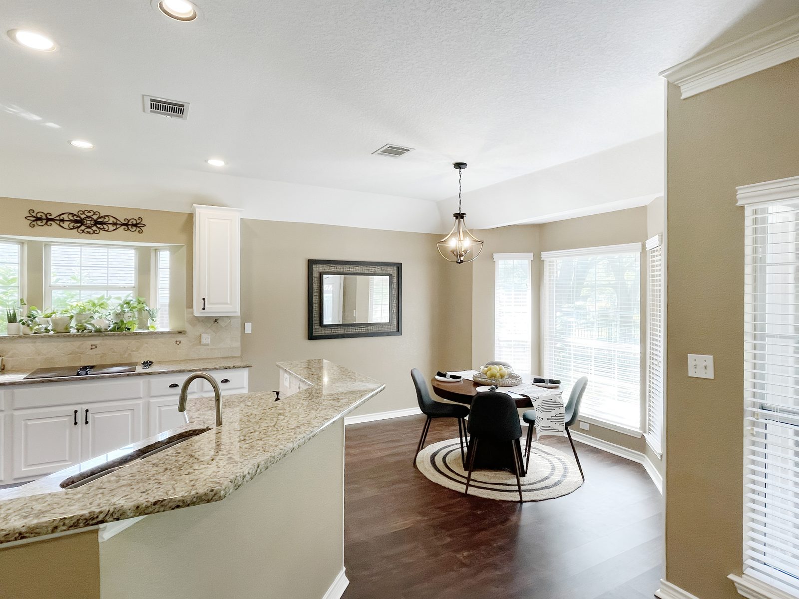 Breakfast nook with round table and chandelier